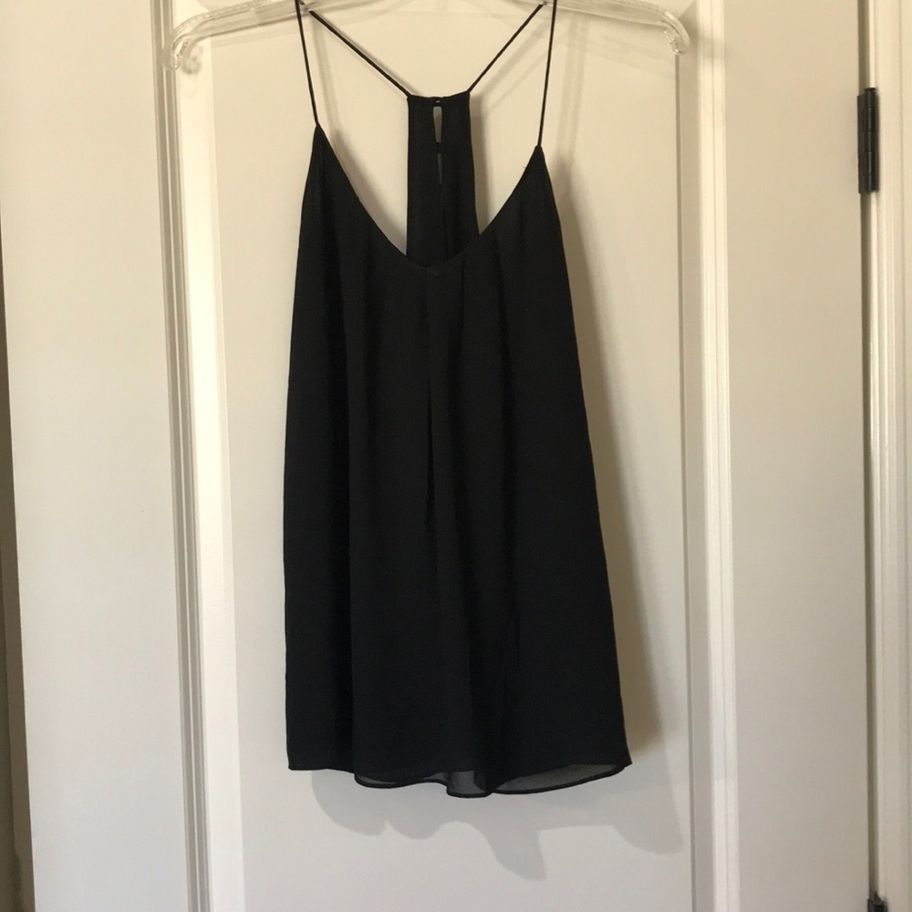 Black strappy tank top with gold buttons.